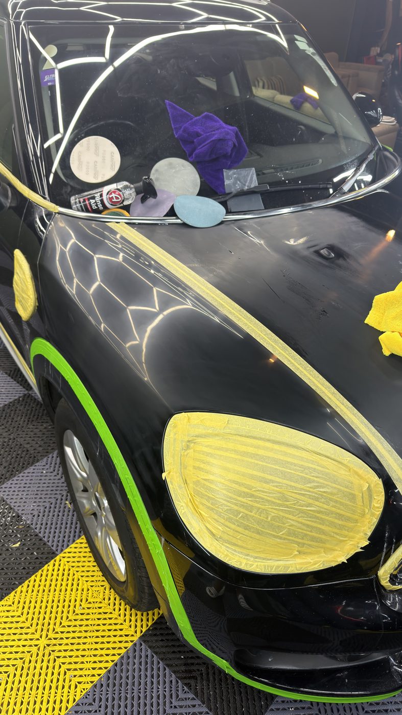Mini Cooper hood — paint correction in progress, surface preparation stage